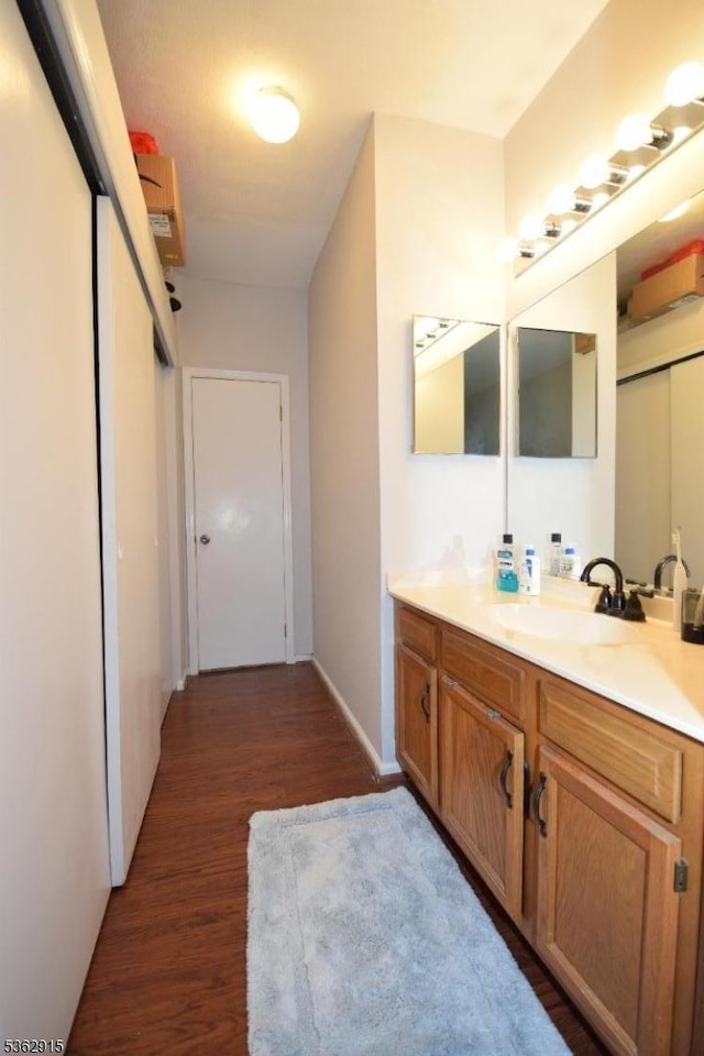 97 Wescott Rd, Bedminster Twp, NJ 07921 - bathroom with wood finished floors, vanity, and baseboards