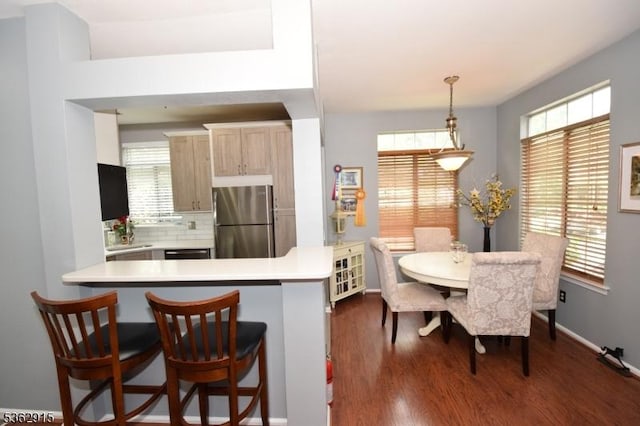 97 Wescott Rd, Bedminster Twp, NJ 07921 - kitchen with freestanding refrigerator, light countertops, dark wood-style flooring, backsplash, and a peninsula