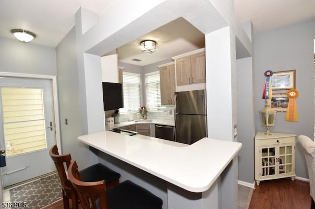 97 Wescott Rd, Bedminster Twp, NJ 07921 - kitchen with freestanding refrigerator, dishwasher, a peninsula, light countertops, and dark wood finished floors