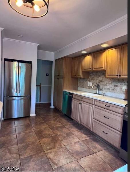 10 Grandin Dr, Raritan Twp, NJ 08822 - kitchen featuring freestanding refrigerator, dishwasher, crown molding, light countertops, and a sink