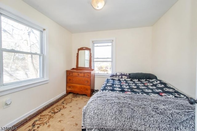 13 Franklin Pl, Wanaque Boro, NJ 07420 - bedroom featuring multiple windows, light wood-style flooring, and baseboards