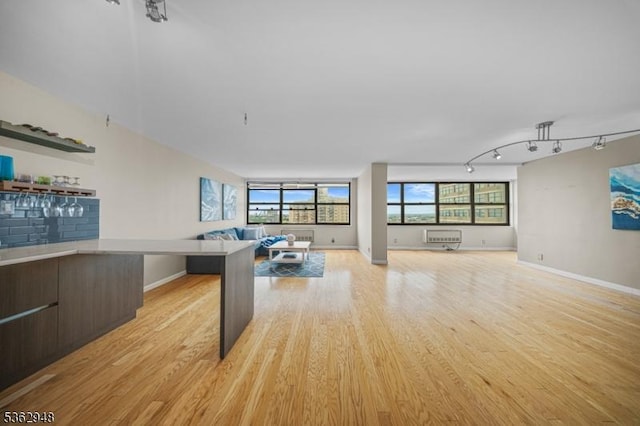 7002 Kennedy Blvd Unit 36G, Guttenberg Town, NJ 07093 - unfurnished living room with light wood-type flooring and baseboards
