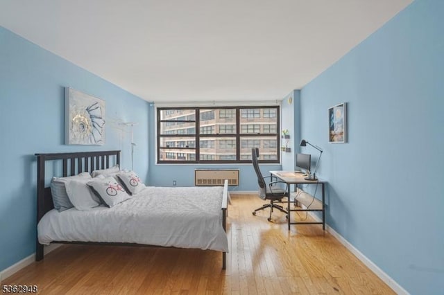 7002 Kennedy Blvd Unit 36G, Guttenberg Town, NJ 07093 - bedroom featuring light wood-style floors, an office area, and baseboards