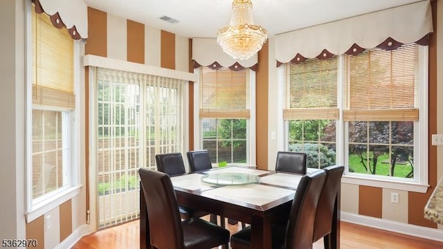 9 Independence Ct, Franklin Twp, NJ 08873 - dining room with a chandelier and light wood-type flooring