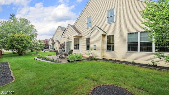 9 Independence Ct, Franklin Twp, NJ 08873 - back of house featuring a patio and a lawn