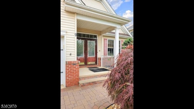 9 Independence Ct, Franklin Twp, NJ 08873 - view of exterior entry featuring brick siding and french doors