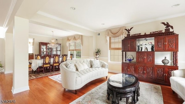 9 Independence Ct, Franklin Twp, NJ 08873 - living room with wood finished floors, a chandelier, and crown molding