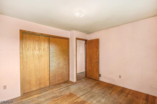 16 Sunset Trl, Rockaway Twp, NJ 07866 - unfurnished bedroom with wood finished floors and a closet