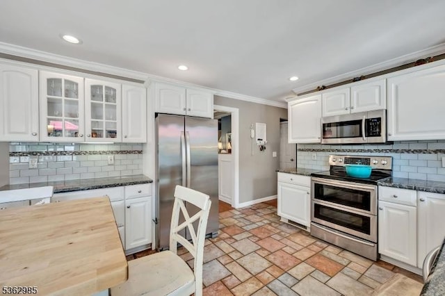 500 Charlestown Rd, Bethlehem Twp, NJ 08827 - kitchen featuring stainless steel appliances, ornamental molding, light stone finish flooring, glass insert cabinets, and decorative backsplash