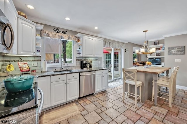 500 Charlestown Rd, Bethlehem Twp, NJ 08827 - kitchen featuring appliances with stainless steel finishes, ornamental molding, open shelves, white cabinets, and stone tile floors