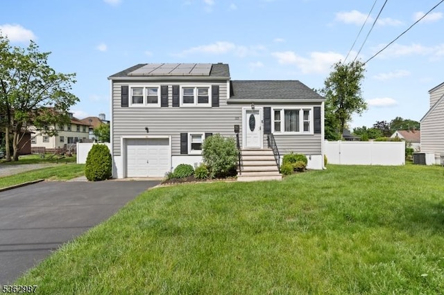 315 D St, Middlesex Boro, NJ 08846 - split level home featuring solar panels, a garage, asphalt driveway, cooling unit, and a shingled roof