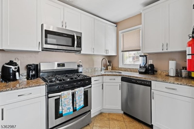 315 D St, Middlesex Boro, NJ 08846 - kitchen featuring stainless steel appliances, a sink, white cabinetry, and light stone countertops