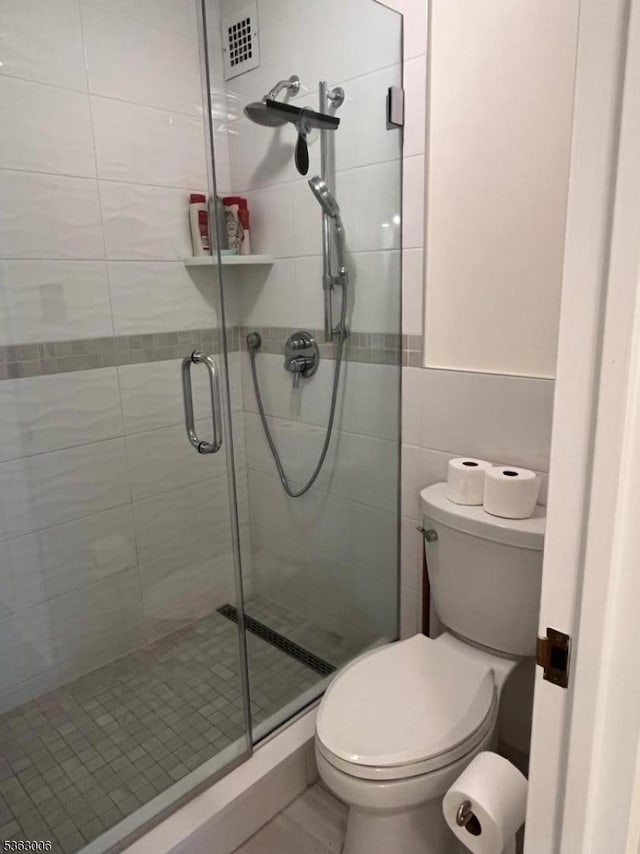 2 Claridge Dr Unit 7Ie, Verona Twp, NJ 07044 - bathroom featuring a shower stall and tile walls