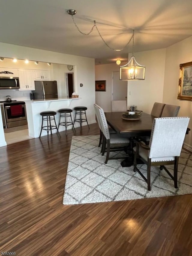 2 Claridge Dr Unit 7Ie, Verona Twp, NJ 07044 - dining room featuring wood finished floors and a chandelier