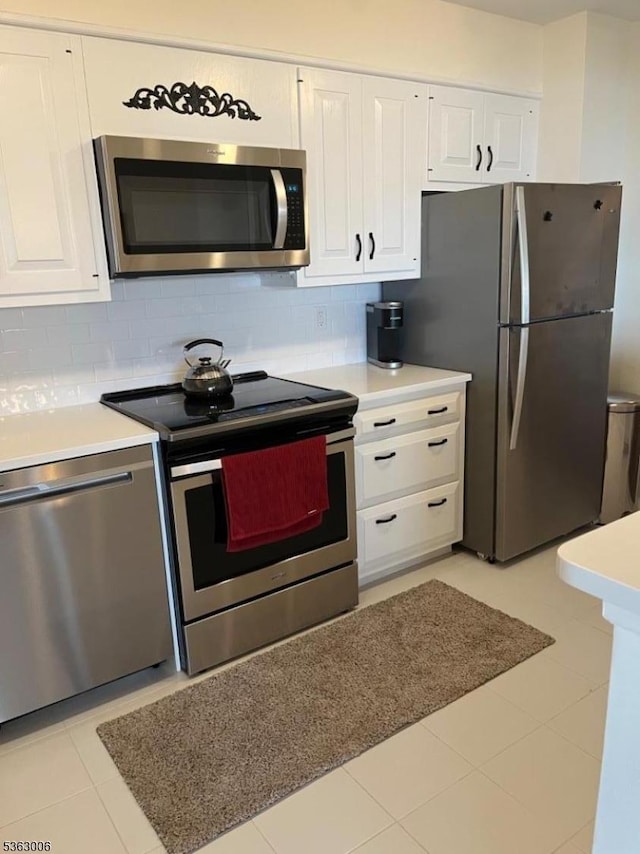 2 Claridge Dr Unit 7Ie, Verona Twp, NJ 07044 - kitchen featuring appliances with stainless steel finishes, white cabinets, decorative backsplash, and light countertops
