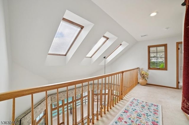 6 Summit Ter, Kinnelon Boro, NJ 07405 - corridor with a skylight, carpet flooring, lofted ceiling, and recessed lighting