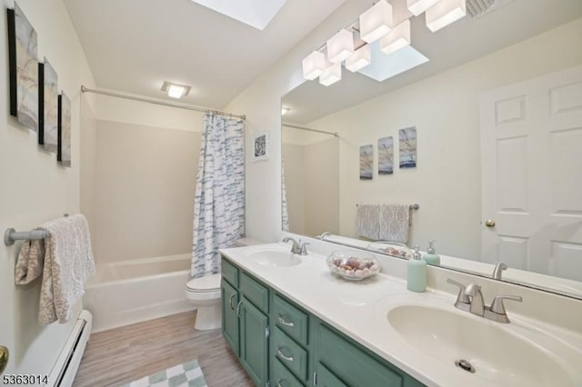 6 Summit Ter, Kinnelon Boro, NJ 07405 - bathroom featuring shower / bath combo with shower curtain, baseboard heating, double vanity, wood finished floors, and a skylight