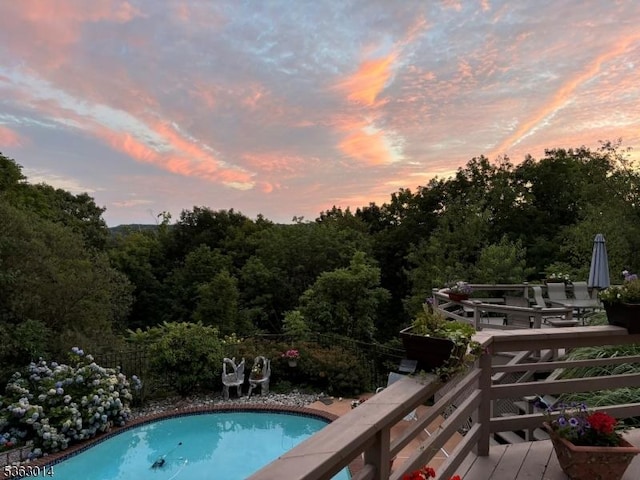 6 Summit Ter, Kinnelon Boro, NJ 07405 - pool at dusk with a wooden deck