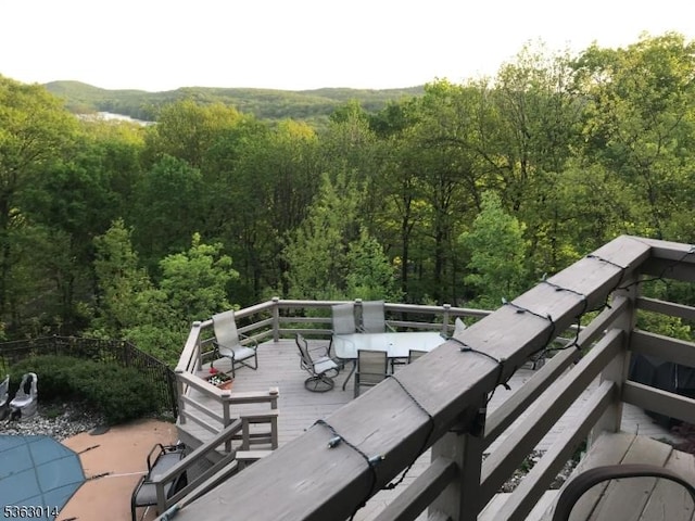 6 Summit Ter, Kinnelon Boro, NJ 07405 - view of patio with a deck, a forest view, and outdoor dining space