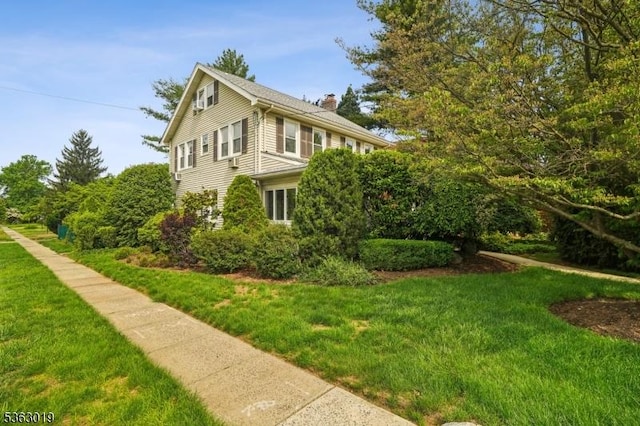 303 Tuttle Pkwy, Westfield Town, NJ 07090 - view of property exterior featuring a chimney and a yard