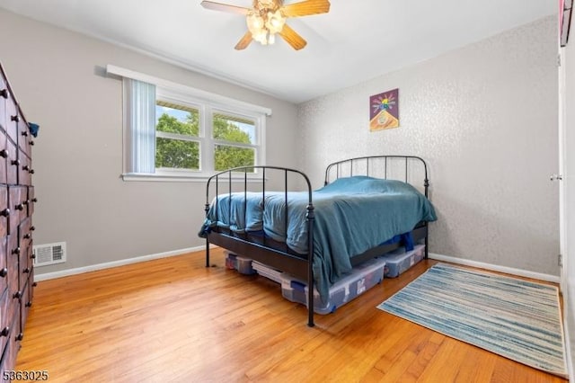 95 1st Ave, Woodbridge Twp, NJ 07064 - bedroom featuring wood finished floors, baseboards, and a ceiling fan