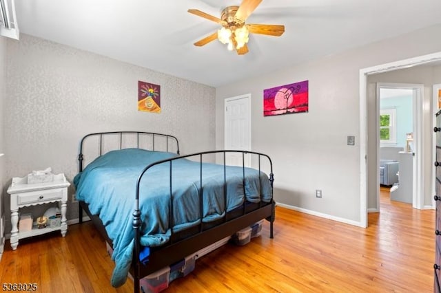 95 1st Ave, Woodbridge Twp, NJ 07064 - bedroom featuring a textured wall, light wood-type flooring, baseboards, and ceiling fan