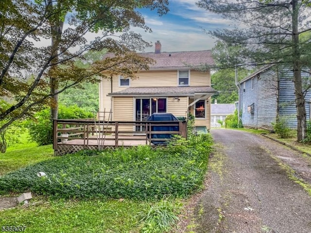 177 Schooleys Mountain Rd, Washington Twp, NJ 07853 - view of front of house with a deck and a chimney