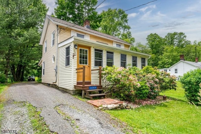 177 Schooleys Mountain Rd, Washington Twp, NJ 07853 - view of front facade with a chimney and a front yard