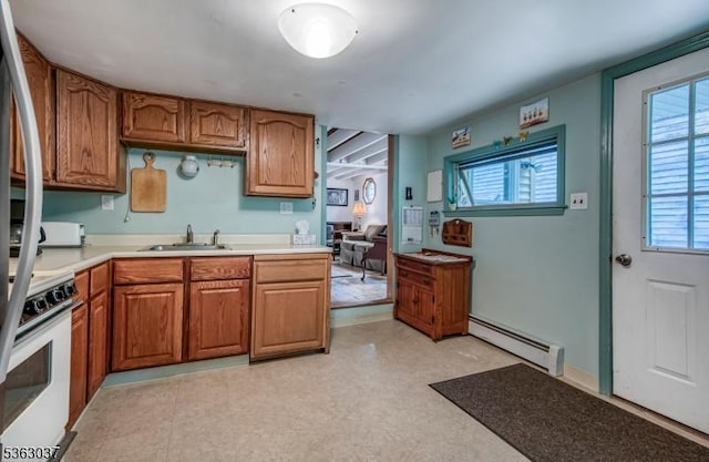 177 Schooleys Mountain Rd, Washington Twp, NJ 07853 - kitchen featuring baseboard heating, white range, light countertops, and brown cabinetry