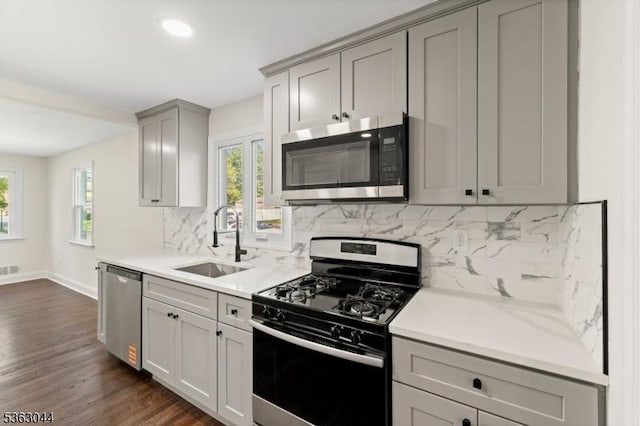 856 Maurice Ave, Rahway City, NJ 07065 - kitchen featuring appliances with stainless steel finishes, a sink, gray cabinets, and plenty of natural light