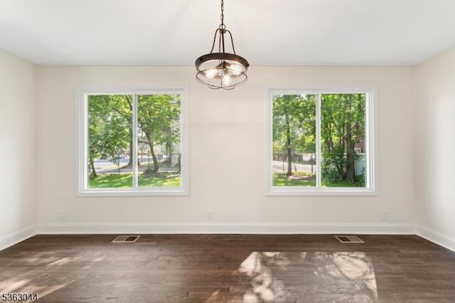 856 Maurice Ave, Rahway City, NJ 07065 - unfurnished dining area with baseboards, dark wood-style floors, and a chandelier