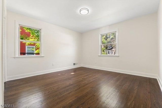 856 Maurice Ave, Rahway City, NJ 07065 - unfurnished room with healthy amount of natural light, dark wood-style flooring, and baseboards