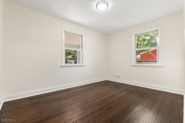 856 Maurice Ave, Rahway City, NJ 07065 - unfurnished room with dark wood-style flooring and baseboards