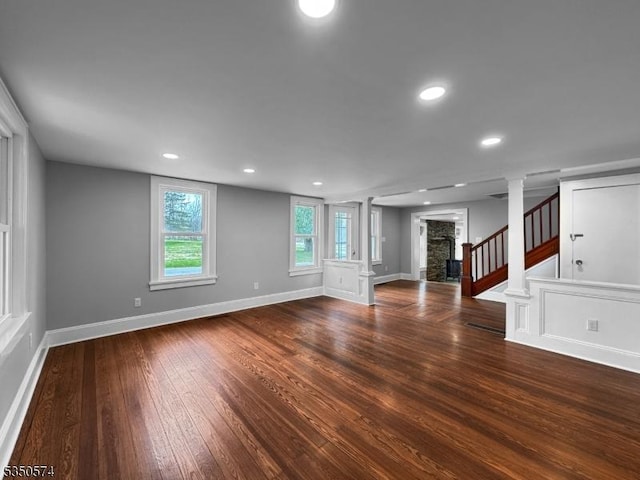 150 Mt Salem Rd, Wantage Twp, NJ 07461 - unfurnished living room featuring wood-type flooring, baseboards, a fireplace, stairway, and recessed lighting