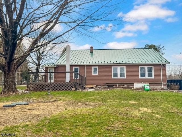 150 Mt Salem Rd, Wantage Twp, NJ 07461 - rear view of property with a chimney, a lawn, metal roof, a wooden deck, and a standing seam roof