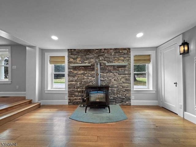 150 Mt Salem Rd, Wantage Twp, NJ 07461 - unfurnished living room with a wood stove, hardwood / wood-style floors, baseboards, healthy amount of natural light, and recessed lighting