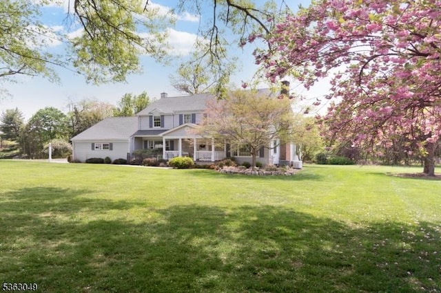29 Country Squire Way, Branchburg Twp, NJ 08876 - view of front facade featuring a front lawn, a porch, and a chimney