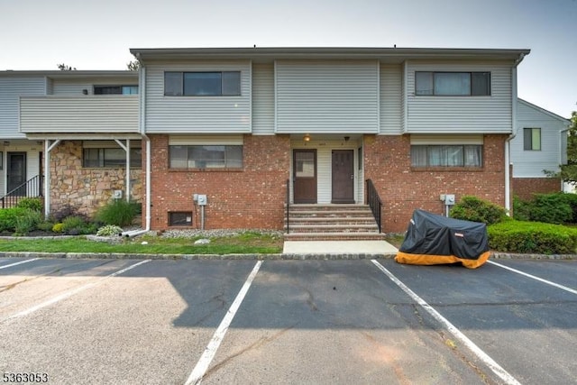 902E Merritt Dr, Hillsborough Twp, NJ 08844 - view of building exterior with uncovered parking and entry steps