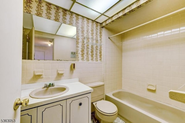 902E Merritt Dr, Hillsborough Twp, NJ 08844 - full bathroom featuring toilet, wallpapered walls, vanity, bathtub / shower combination, and tile walls