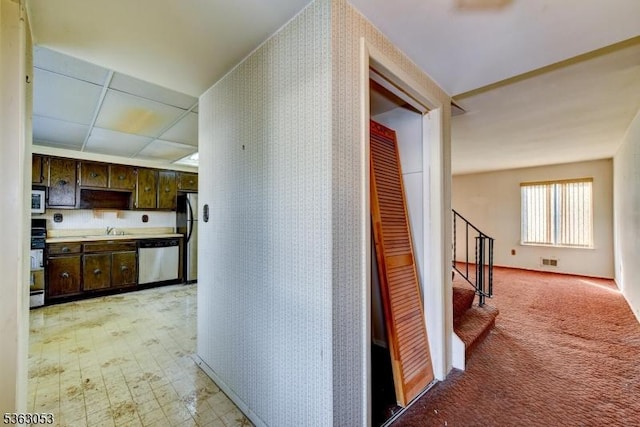 902E Merritt Dr, Hillsborough Twp, NJ 08844 - corridor featuring a sink, stairway, and wallpapered walls
