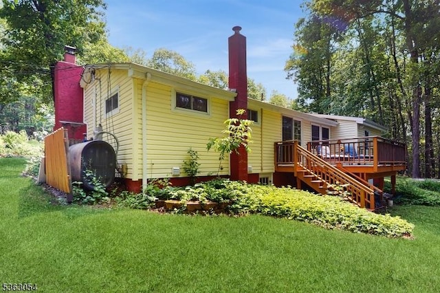 48 Copeley Rd, Hampton Twp, NJ 07860 - rear view of house featuring a chimney, a wooden deck, a yard, and stairway