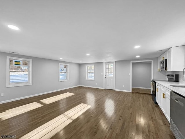 54 Coykendall Rd, Wantage Twp, NJ 07461 - unfurnished living room featuring recessed lighting, a sink, dark wood-style flooring, and baseboards