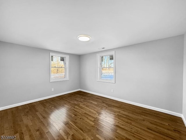 54 Coykendall Rd, Wantage Twp, NJ 07461 - spare room featuring plenty of natural light, dark wood-style floors, and baseboards