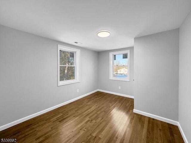 54 Coykendall Rd, Wantage Twp, NJ 07461 - empty room with dark wood-style flooring, baseboards, and plenty of natural light