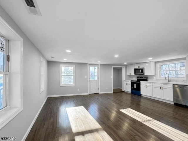 54 Coykendall Rd, Wantage Twp, NJ 07461 - unfurnished living room featuring recessed lighting, baseboards, a sink, and dark wood-style flooring