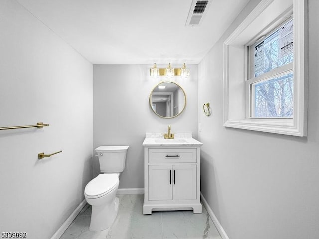 54 Coykendall Rd, Wantage Twp, NJ 07461 - bathroom with marble look tile flooring, baseboards, vanity, and toilet