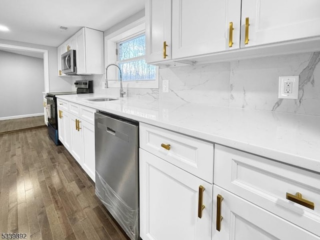 54 Coykendall Rd, Wantage Twp, NJ 07461 - kitchen featuring stainless steel appliances, a sink, dark wood-style floors, white cabinets, and tasteful backsplash