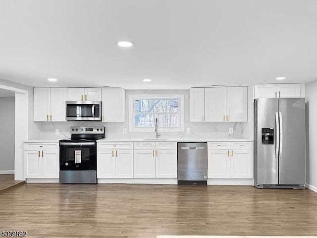 54 Coykendall Rd, Wantage Twp, NJ 07461 - kitchen with stainless steel appliances, a sink, light countertops, recessed lighting, and white cabinetry