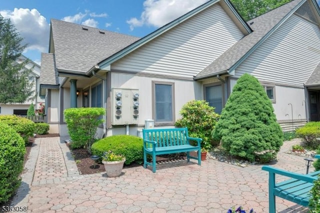 31 Park Edge, Berkeley Heights Twp, NJ 07922 - rear view of house with roof with shingles and a patio area
