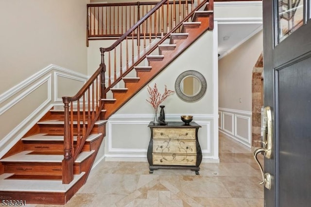 6 Fellen Pl, Hillsborough Twp, NJ 08844 - stairs featuring a decorative wall, wainscoting, arched walkways, and ornamental molding